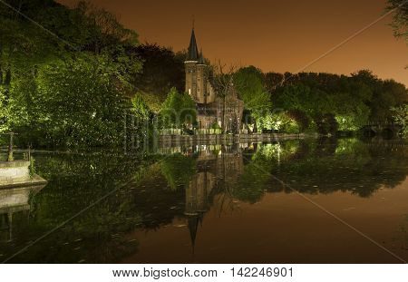 Nocturnal view of Minnewaterpark also known as the lovers lake in Bruges (Belgium)