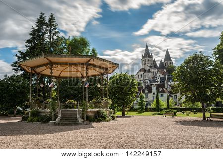 Collegiate Church Saint-Ours Loches of Loches (France). Founded between 963 and 985. View from city park with bandstand