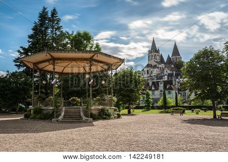 Collegiate Church Saint-Ours Loches of Loches (France). Founded between 963 and 985. View from city park with bandstand