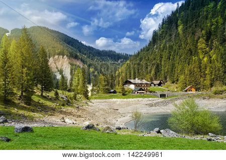 Beautiful View Of Alpine Lake, Gosausee. Traditional Austrian Houses In Alps Mountains.