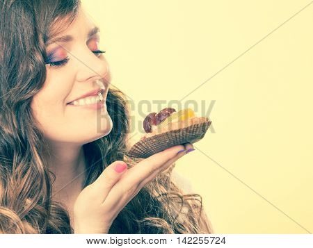 Woman Closed Eyes Holds Cake In Hand