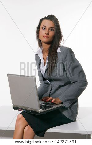 Young beautiful young woman working with laptop