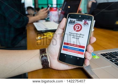 CHIANG MAITHAILAND - MAY 202016 : NEXUS with social Internet service Pinterest on the screen. Pinterest is an online pinboard that allows people to pin their interesting things.