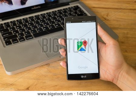 CHIANG MAI THAILAND - 10 JULY 2016: A man hand holding screen shot of google maps app showing on LG G4. Google Maps is most popular mapping service for mobile provided by Google.