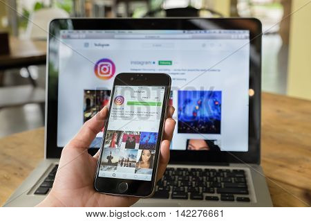 CHIANG MAI THAILAND - JULY 10 2016: A women hand holding iphone with new logo of instagram application. Instagram is largest and most popular photograph social networking.