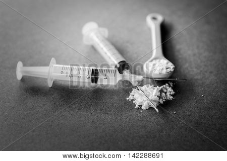 Images of drug needles and drug. The picture is staged and there is no real drugs. (ฺBlack and white Image)
