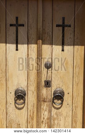 Old door in the stone walls of the village houses. Excellent background