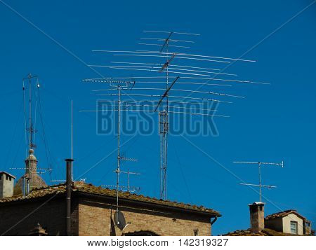 Tv aerial tower on the top of a house
