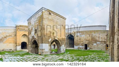 AGZIKARAHAN TURKEY - JANUARY 19 2015: The courtyard of the Agzikarahan Caravan Saray with the small mosque (mescit) in the middle on January 19 in Agzikarahan.