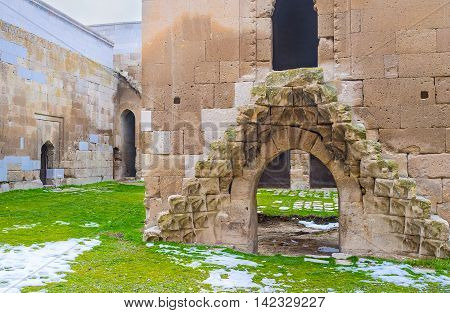 AGZIKARAHAN TURKEY - JANUARY 19 2015: The carved patterns decorate the tiny stairs leading to the small mosque (mescit) in the courtyard of Agzikarahan Caravan Saray on January 19 in Agzikarahan.