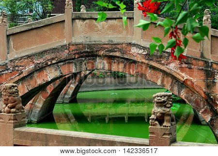 Deyang China - July 8 2007: Three graceful bridges span the Pan Pond at the 13th century Deyang Confucian Temple *