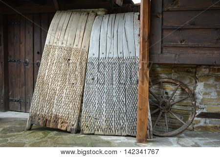 A threshing board is an obsolete farm implement used to separate cereals from their straw