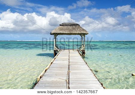 Landscape witn wooden pier in Bel Ombre beach, Mauritius island