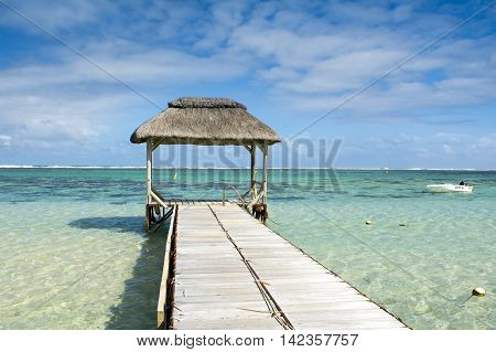 Landscape witn wooden pier in Bel Ombre beach, Mauritius island