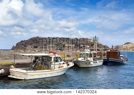 CRETE ISLAND, GREECE - JUNE 20, 2016: View from pier to the fortress island of Spinalonga, Crete island, Greece, June 20, 2016