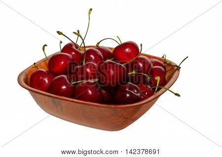 Plate of ripe cherries on isolated background