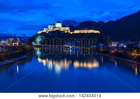 Castle Kufstein reflecting in Inn river in Austria - architecture and travel background
