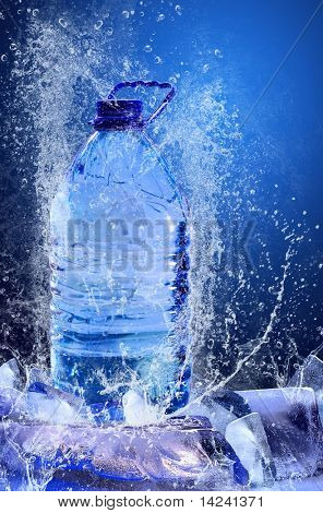 Buttle of water on the ice. Splash of water