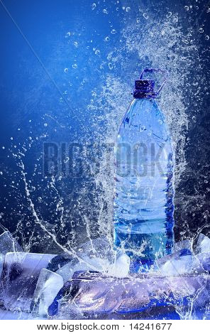 Buttle of water on the ice. Splash of water