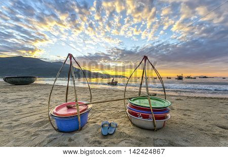Da Nang, Vietnam, June 26th, 2015: Double strickle, slippers expected to welcome the new day afar who came back, this is the vehicle for trafficking fishermen fish in waters so simple, rustic but rich emotional meaning of life