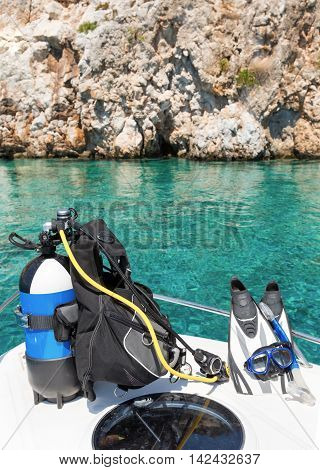 Scuba diving equipment and fins on a boat