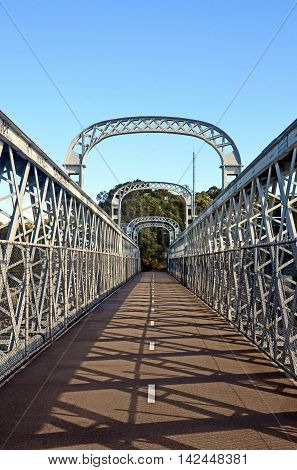 Walkway over an arched bridge that spans the Woronora River, Sutherland Shire, New South Wales, Australia