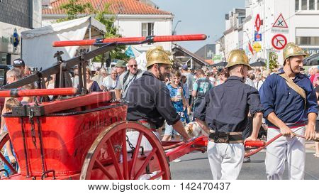 Firefighters Have An Antique Pump Early 20Th Century