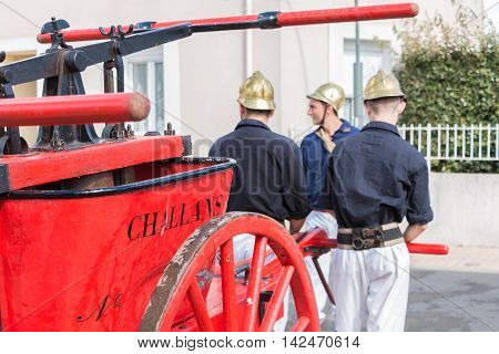 Firefighters Have An Antique Pump Early 20Th Century