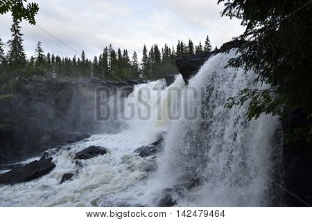Waterfall with white water (Ristafallet) from the North of Sweden.