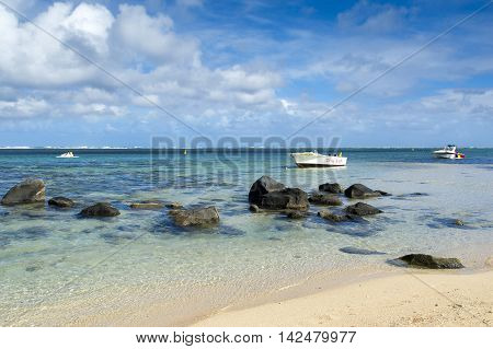 BEL OMBRE, MAURITIUS ISLAND - JUNE 16, 2016: Diving boats in Bel Ombre rocky beach, Mauritius island, June 16, 2016