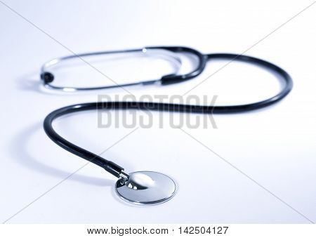 Medical stethoscope with selective focus on the foreground.