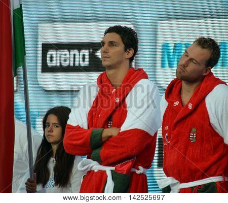 Budapest Hungary - Jul 15 2014. Daniel Varga and Viktor Nagy (sleeping) from the hungarian team waiting for the start. The Waterpolo European Championship was held in Alfred Hajos Swimming Centre in 2014.