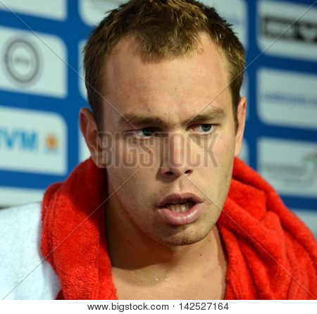 Budapest Hungary - Jul 15 2014. Balazs Erdelyi (HUN 4) talking after Hungary-France preliminary match. The Waterpolo European Championship was held in Alfred Hajos Swimming Centre in 2014.