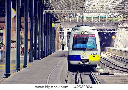 Bilbao Spain - June 10 2010: Passenger diesel train of Feve railway company stands at the underground station. Feve railway connects Hendaye France and Ferrol northwest Spain.