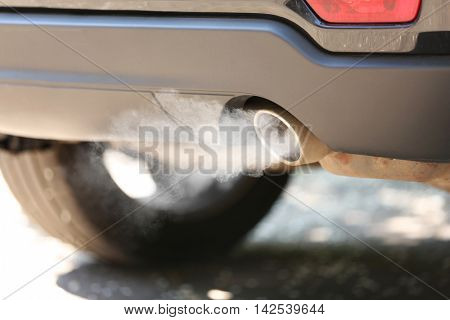 Exhaust pipe with smoke emission. Air pollution concept.