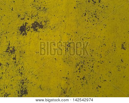 aged and decayed yellow surface made of metal