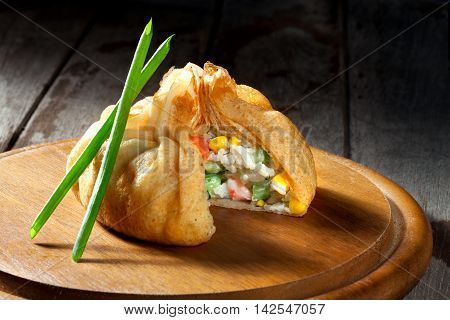 view of nice fresh hot crepes with fruit dessert  on color background