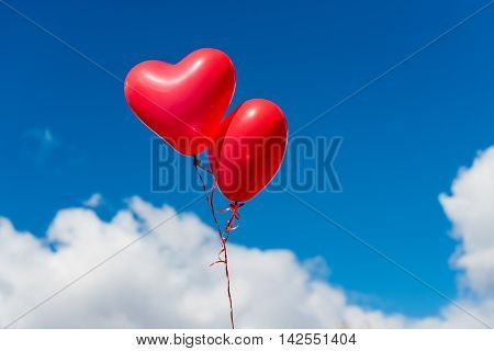 Valentine heart balloon against blue sky background