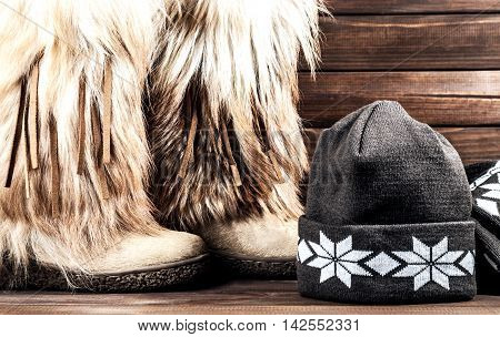 Stylish women's winter boots with fur scarf and hat