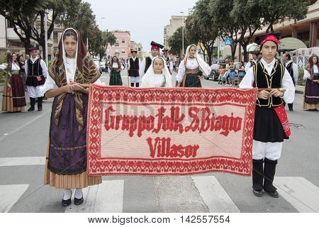 QUARTU S.E., ITALY - September 15, 2013: Wine Festival in honor of the celebration of St. Helena - Sardinia - Parade of folk group San Biagio di Villasor