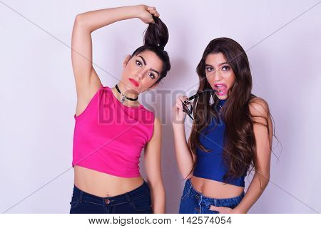 Preview
Save to a lightbox
 Find Similar Images  Share
Stock Photo:
Portrait of two beautiful women having fun together. Friendship concept. Trendy and stylish friends isolated over grey background.