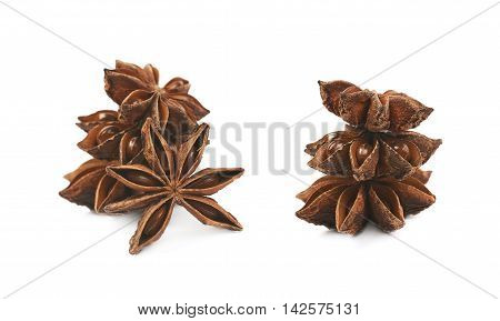 Pile of multiple Chinese star anise seeds, composition isolated over the white background, set of two different foreshortenings