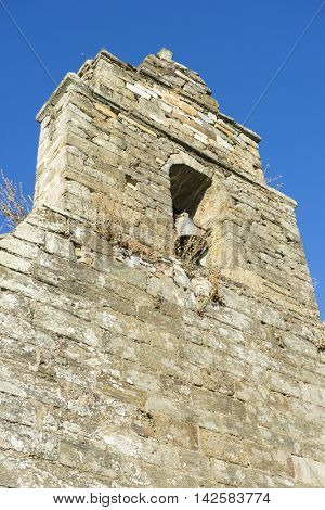 Old bell tower, wood and stone houses in the province of Zamora in Spain