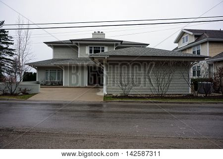 WEQUETONSING, MICHIGAN / UNITED STATES - DECEMBER 23, 2015: A large, elegant home on Beach Drive in Wequetonsing, Michigan.