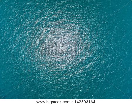 the surface of the water, turquoise in color with bird's eye