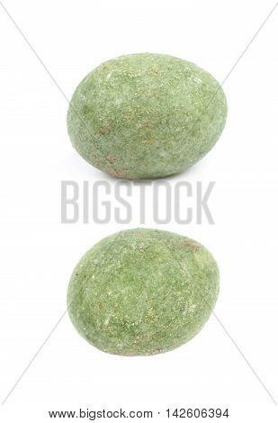 Green wasabi coated peanut isolated over the white background, set of two different foreshortenings