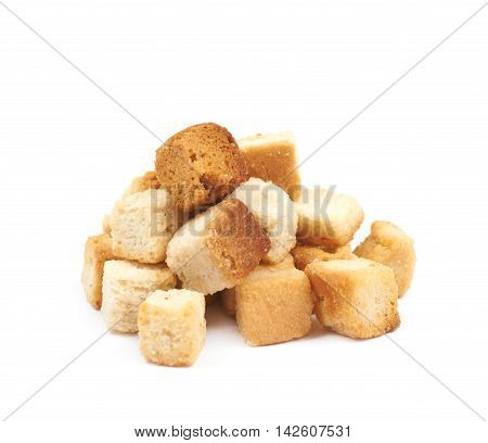 Pile of garlic white bread croutons isolated over the white background