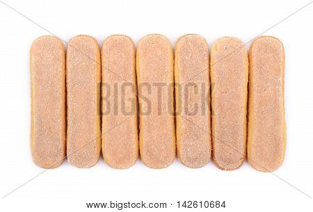 Ladyfinger savoiardi biscuit cookies lined up, composition isolated over the white background