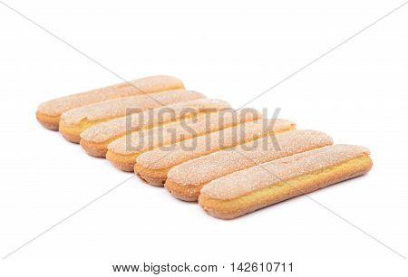 Ladyfinger savoiardi biscuit cookies lined up, composition isolated over the white background