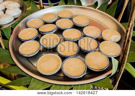 Coconut milk custard in small porcelain cup
